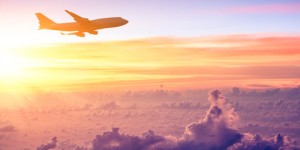 Plane over Beautiful Clouds - American